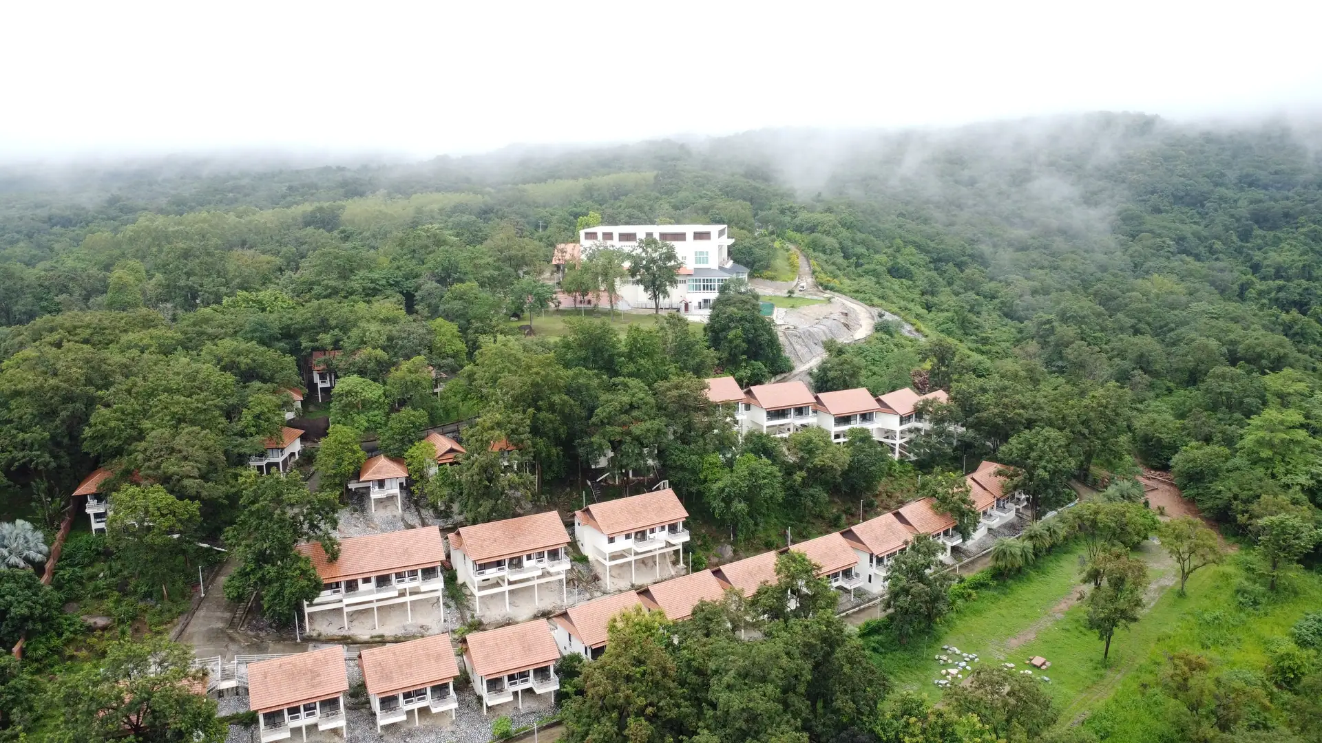 Aerial view of the resort in the forest with mist on Khao Chan Ngam