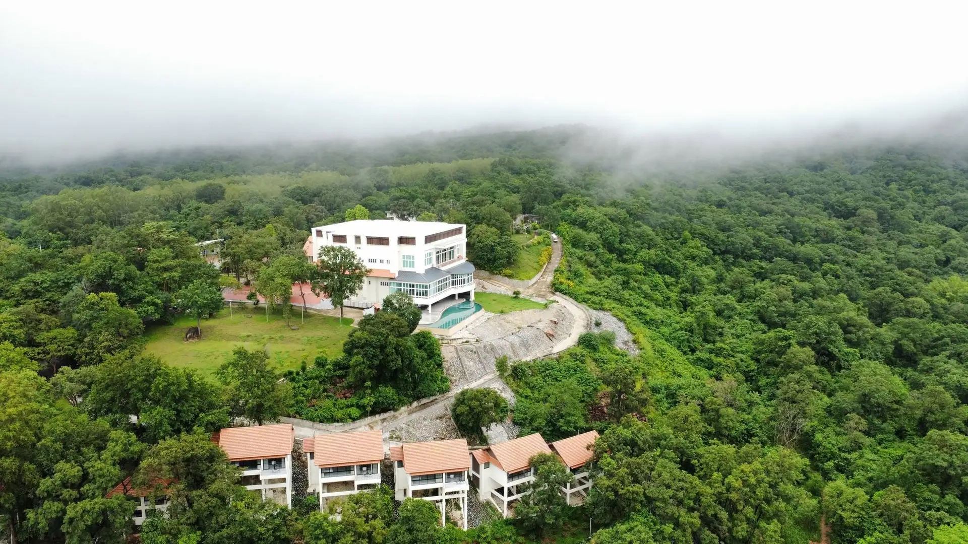 Morning mist over the resort and the forest around it