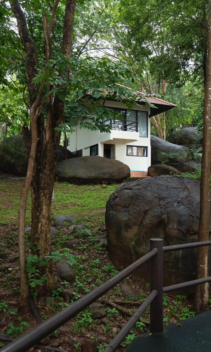 A villa among the trees and sandstone boulders